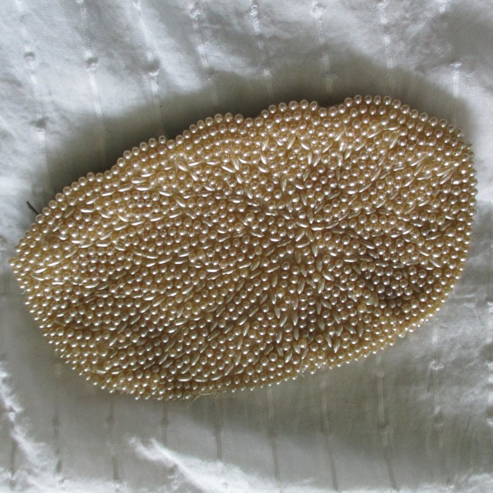 Champagne colored beaded clutch